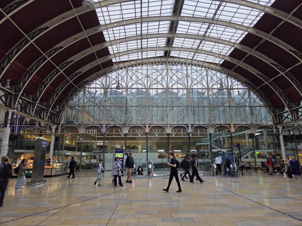 Train pedestrians at Paddington Station, London, England.